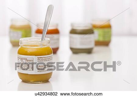 Stock Image - Studio shot of jars with baby food. Fotosearch