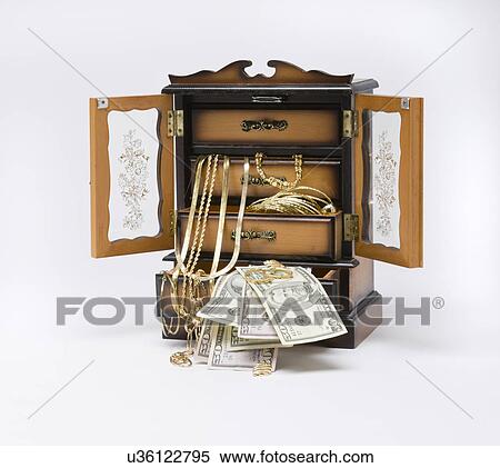 Studio shot of Jewelry box filled with jewelry and money View Large Photo Image Stock Photography - Studio shot of Jewelry box filled with jewelry and money. Fotosearch
