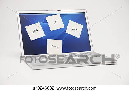 Stock Image - Studio shot of laptop with adhesive notes on screen. Fotosearch