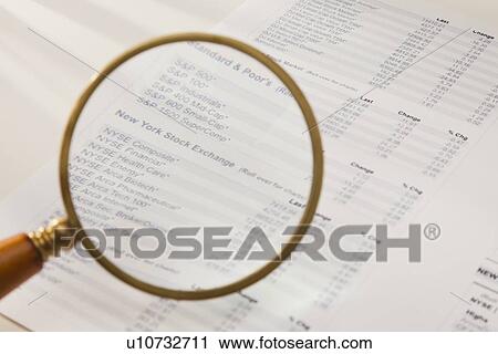 Studio shot of magnifying glass over financial pages View Large Photo Image Stock Image - Studio shot of magnifying glass over financial pages. Fotosearch