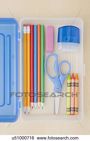 Stock Photograph - Studio shot of multicolored crayons and scissors in pencil case. Fotosearch