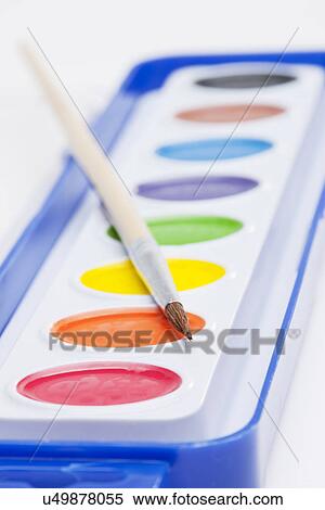 Stock Photography - Studio shot of multicolored paints and paintbrush. Fotosearch