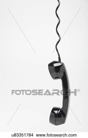 Studio shot of old-fashioned telephone receiver View Large Photo Image Picture - Studio shot of old-fashioned telephone receiver. Fotosearch