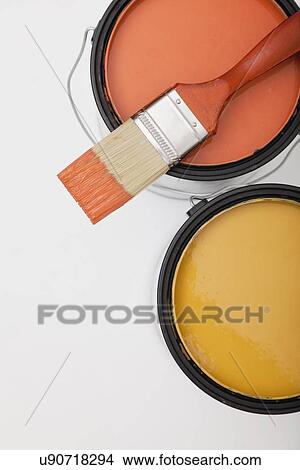 Picture - Studio shot of paint brush on paint cans. Fotosearch