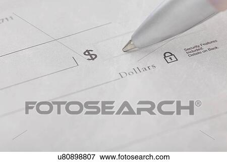 Stock Photo - Studio shot of pen writing on receipt. Fotosearch