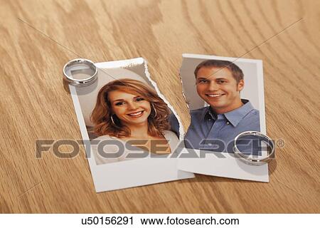Studio shot of photo of couple torn in half and wedding rings View Large Photo Image Stock Image - Studio shot of photo of couple torn in half and wedding rings. Fotosearch