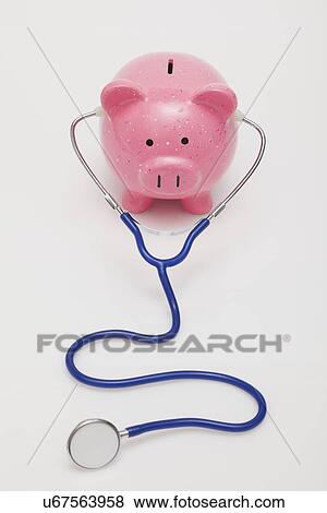 Studio shot of piggy bank with stethoscope View Large Photo Image Stock Photo - Studio shot of piggy bank with stethoscope. Fotosearch