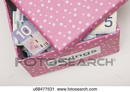 Studio shot of pink box with banknotes View Large Photo Image Stock Image - Studio shot of pink box with banknotes. Fotosearch