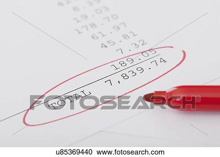 Stock Image - Studio shot of receipt with red pen. Fotosearch