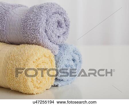 Studio shot of rolled up of pastel colored towels View Large Photo Image Picture - Studio shot of rolled up of pastel colored towels. Fotosearch