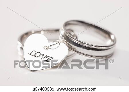 Studio shot of silver wedding rings View Large Photo Image Stock Photography - Studio shot of silver wedding rings. Fotosearch