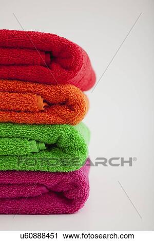 Studio shot of stack of colorful towels View Large Photo Image Stock Image - Studio shot of stack of colorful towels. Fotosearch