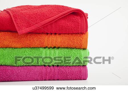 Stock Photo - Studio shot of stack of colorful towels. Fotosearch