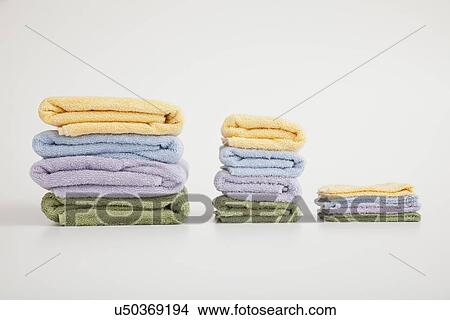 Studio shot of stack of pastel colored towels View Large Photo Image Picture - Studio shot of stack of pastel colored towels. Fotosearch