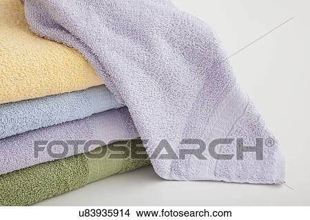 Studio shot of stack of pastel colored towels View Large Photo Image Picture - Studio shot of stack of pastel colored towels. Fotosearch