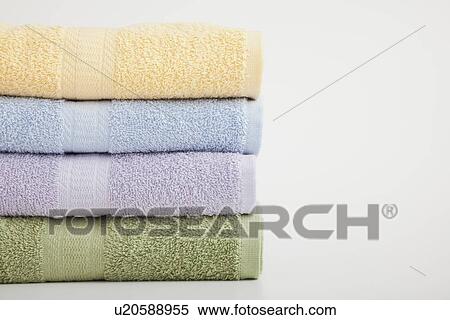Stock Photography - Studio shot of stack of pastel colored towels. Fotosearch
