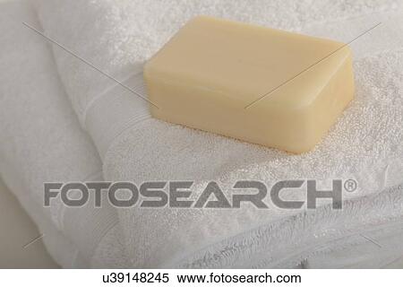 Studio shot of stack of white towels and soap View Large Photo Image Stock Photography - Studio shot of stack of white towels and soap. Fotosearch