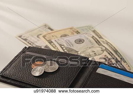 Studio shot of wallet with money View Large Photo Image Stock Photo - Studio shot of wallet with money. Fotosearch