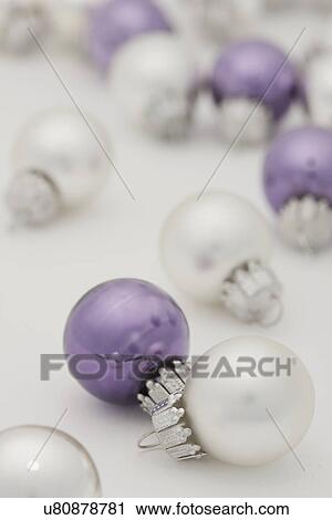 Studio shot of white and purple Christmas ornaments View Large Photo Image Stock Image - Studio shot of white and purple Christmas ornaments. Fotosearch