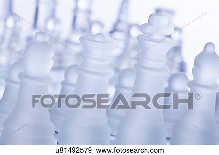 Stock Photo - Studio shot of white chess pieces. Fotosearch