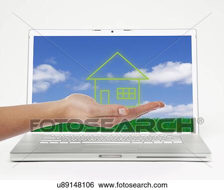Studio shot of woman's hand in front of laptop with drawing of house View Large Photo Image Stock Photograph - Studio shot of woman's hand in front of laptop with drawing of house. Fotosearch
