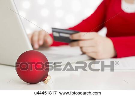 Teenage girl (14-15) shopping online View Large Photo Image Stock Photo - Teenage girl (14-15) shopping online. Fotosearch