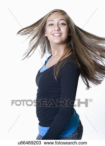 Stock Image - Teenage girl dancing, portrait. Fotosearch