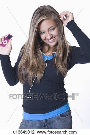 Teenage girl listening to ipod, dancing View Large Photo Image Stock Image - Teenage girl listening to ipod, dancing. Fotosearch