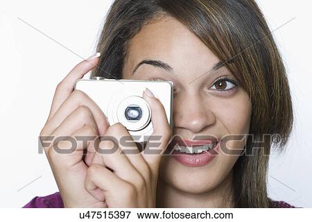 Teenage girl using digital camera View Large Photo Image Stock Photo - Teenage girl using digital camera. Fotosearch