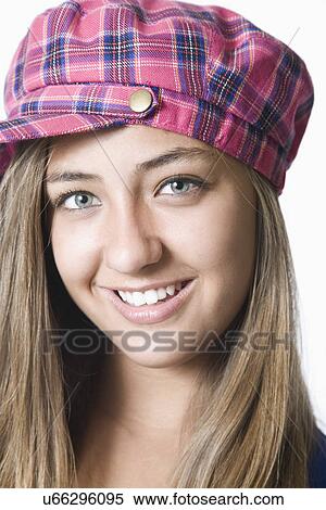Stock Photography - Teenage girl wearing hat, portrait. Fotosearch
