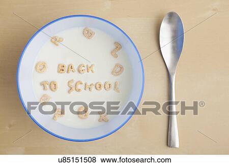 Stock Photo - Text 'back to school' made of cereals in milk soup, studio shot. Fotosearch