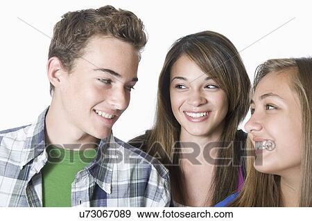 Three friends smiling View Large Photo Image Stock Photo - Three friends smiling. Fotosearch