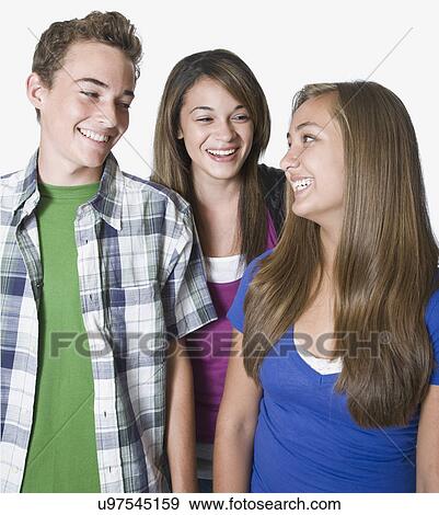 Three teenage friends smiling View Large Photo Image Stock Photo - Three teenage friends smiling. Fotosearch