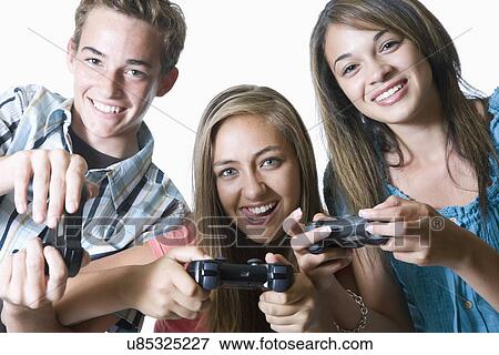 Stock Photo - Three teenage friends with digital cameras, portrait. Fotosearch