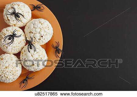Toy spiders crawling on popcorn balls View Large Photo Image Stock Photography - Toy spiders crawling on popcorn balls. Fotosearch