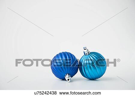 Two blue Christmas baubles View Large Photo Image Stock Photo - Two blue Christmas baubles. Fotosearch