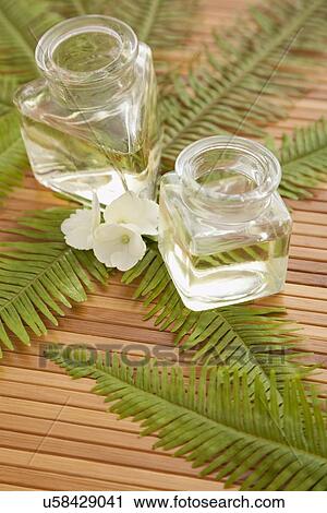 Two jars with massage oil in beauty spa, Studio shot View Large Photo Image Stock Image - Two jars with massage oil in beauty spa, Studio shot. Fotosearch