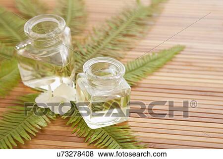 Two jars with massage oil in beauty spa, Studio shot View Large Photo Image Stock Photo - Two jars with massage oil in beauty spa, Studio shot. Fotosearch