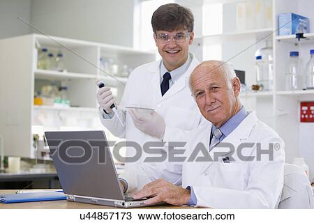 Stock Image - Two male scientists. Fotosearch