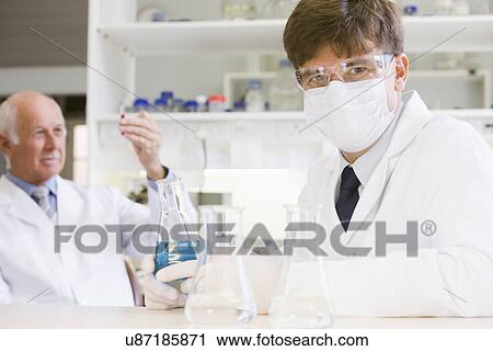 Two scientist doing research in laboratory View Large Photo Image Stock Image - Two scientist doing research in laboratory. Fotosearch