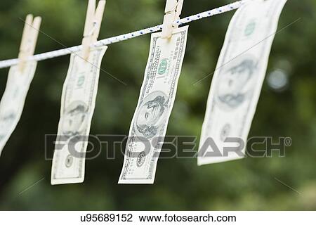 US currency hanging on clothesline View Large Photo Image Stock Image - US currency hanging on clothesline. Fotosearch