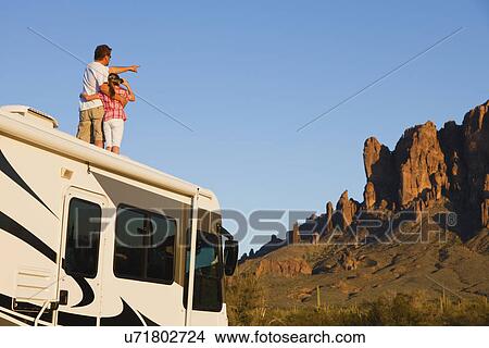 USA, Arizona, father and daughter (10-11) standing on roof of motor home View Large Photo Image Picture - USA, Arizona, father and daughter (10-11) standing on roof of motor home. Fotosearch