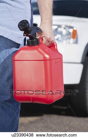 USA, Arizona, Man standing with canister View Large Photo Image Stock Photo - USA, Arizona, Man standing with canister. Fotosearch
