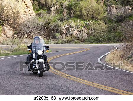 USA, Arizona, Phoenix, Biker on motorcycle in mountain area View Large Photo Image Stock Image - USA, Arizona, Phoenix, Biker on motorcycle in mountain area. Fotosearch