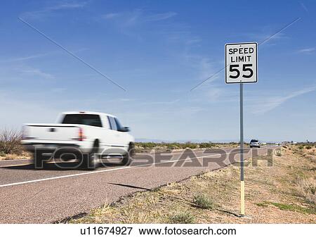 Stock Photo - USA, Arizona, Pick-up truck on road. Fotosearch