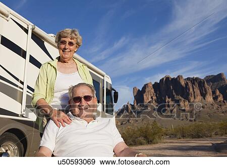 USA, Arizona, Senior couple sitting next to motor home View Large Photo Image Stock Photo - USA, Arizona, Senior couple sitting next to motor home. Fotosearch