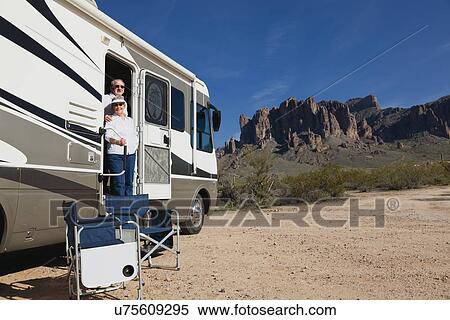 USA, Arizona, Senior couple sitting next to motor home View Large Photo Image Stock Photography - USA, Arizona, Senior couple sitting next to motor home. Fotosearch