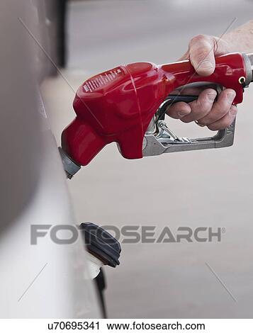 USA, Arizona, senior man refueling car View Large Photo Image Stock Image - USA, Arizona, senior man refueling car. Fotosearch
