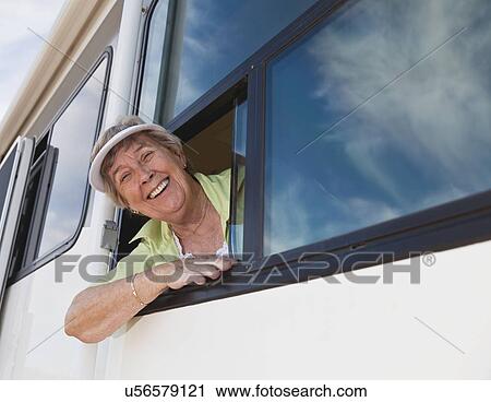 USA, Arizona, Senior woman wearing sunglasses looking through window of motor home View Large Photo Image Stock Image - USA, Arizona, Senior woman wearing sunglasses looking through window of motor home. Fotosearch