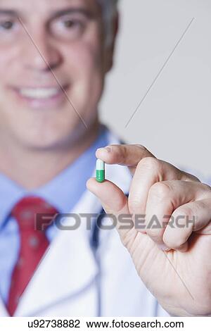 USA, California, Fairfax, close-up of doctor's hand holding pill View Large Photo Image Stock Image - USA, California, Fairfax, close-up of doctor's hand holding pill. Fotosearch